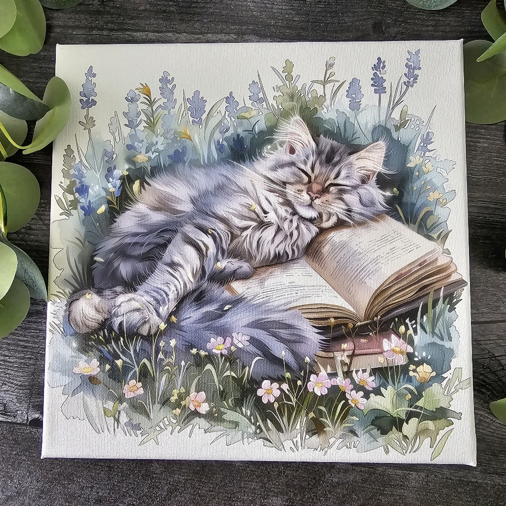 Cozy Cat Sleeping On Book Canvas Art